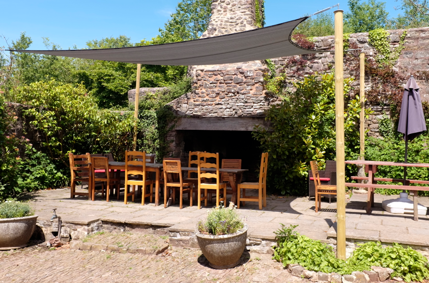 Al fresco dinning with a gas BBQ in a walled magical courtyard